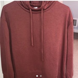 pinkish hooded shirt